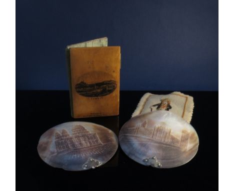 Two needle books and two carved mother of pearl roundels 