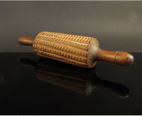 A 19th Century treen pastry roller, 31cm long 