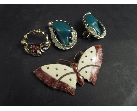 A diamond and ruby set circular brooch, an enamel butterfly brooch and a pair of paste set earrings 