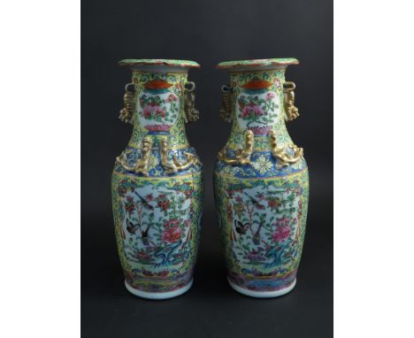 A pair of Chinese Qing Dynasty poly chrome enamel decorated baluster form porcelain vases - applied dragon and fu lion embell