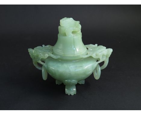 A 20th Century jade incense burner, carved frog knop, lion mask ring handles, 13cm tall