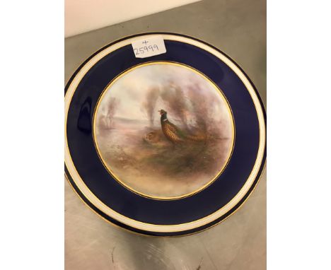A Royal Worcester plate signed Stinton depicting a pheasant in landscape