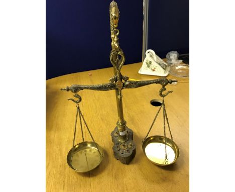 A 19th century set of brass scales with weights set to base