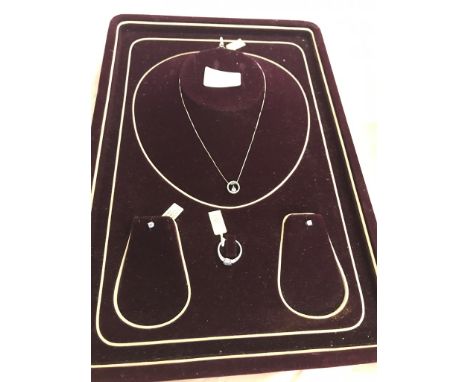 Demi parure of diamond and tanzanite jewellery by Nart, comprising earrings, ring and necklace set in silver