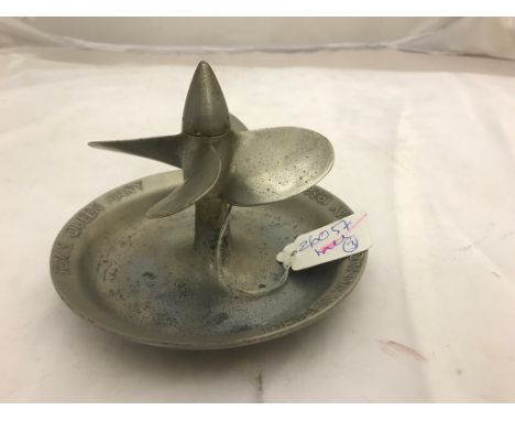 An RMS Queen Mary Ashtray modelled on the propeller of the ship which turns  Moulded ashtray has to the top written "R.M.S. Q