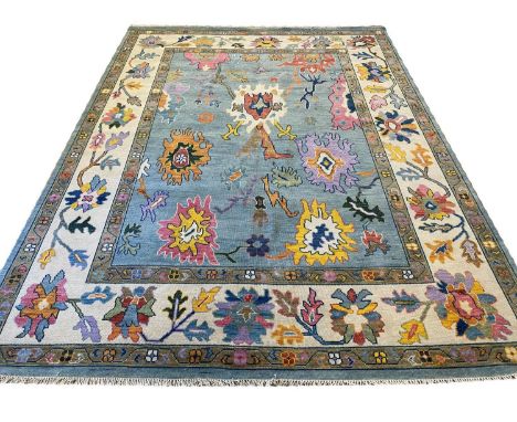 FINE CONTEMPORARY OUSHAK CARPET, 330cm x 250cm. 