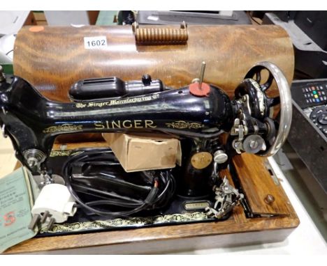 Singer sewing machine, #Y5577186. All electrical items in this lot have been PAT tested for safety and have passed. This does