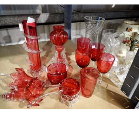 Eleven pieces of Cranberry glass, including a set of four wine glasses and two epergne flutes. Not available for in-house P&a