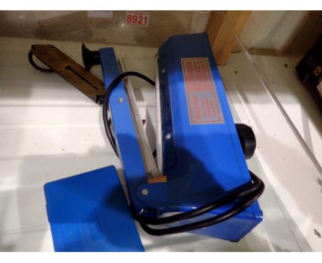 Impulse sealer model FS-200 with a cased set of calibration weights and a vintage salter brass pocket balance. All electrical
