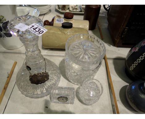 Crystal decanter with a white metal port decanter label, Waterford crystal clock and two lidded crystal pots. Not available f