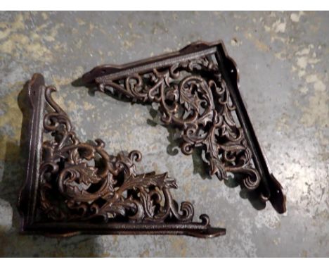 Pair of cast iron shelf brackets, H: 28 cm.