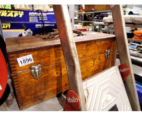 Wooden toolbox containing tools, including Stilsons. Not available for in-house P&amp;P