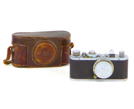 A vintage 1930s Leica camera, with Leitz Elmar 1:3.5 f=50mm lens, serial no. 168496, with chrome and black body, and vintage 