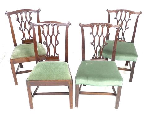 A group of four George III mahogany dining chairs, two pairs, 56 by 55 by 96cm high and 54 by 54 by 98cm high in Chippendale 