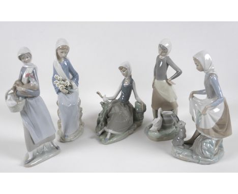 A group of five Lladro figures, comprising Armful of Lilies, number 4972, 24cm high, Peasant Girl with Dove, number 4660, 16.