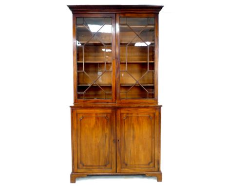 A George IV / William IV mahogany bookcase, by Wilkinson, Ludgate Hill, twin astragal glazed doors enclosing four shelves, be