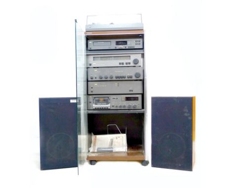 A modern stereo system, comprising NAD series 20 Power Amp 2140, Pre Amp 1020, CD player 5240, Tape Deck 6050C, AM/FM Stereo 