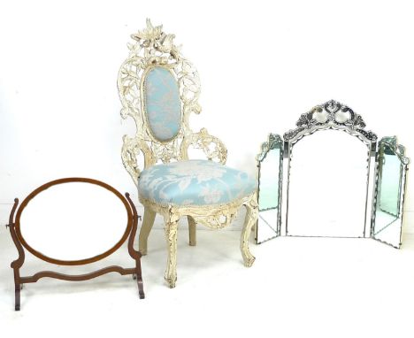 A Victorian nursing chair with cream painted carved frame, raised on cabriole legs to the front and square section to the bac