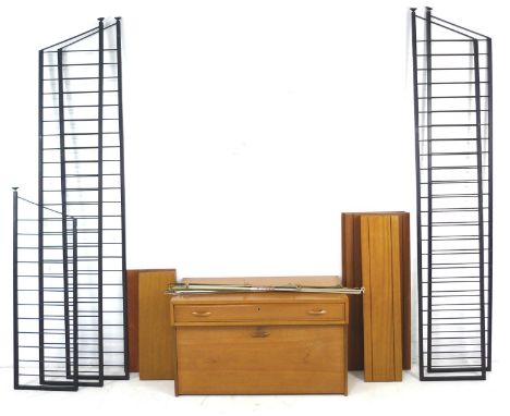 A set of Ladderax, Staples, adjustable shelving units, with two storage and desk units, nine shelves, and five ladder support