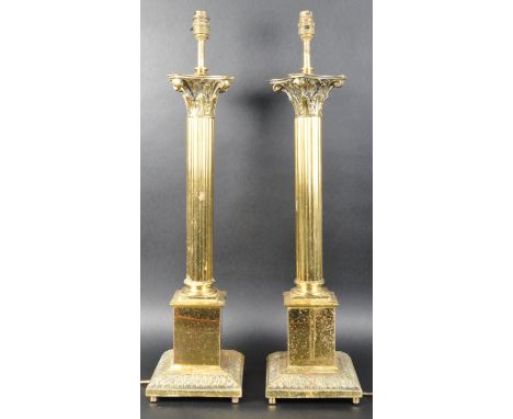 A matching pair of retro vintage 20th Century 1980s Hollywood Regency large brass table lamp lights of classical column form 