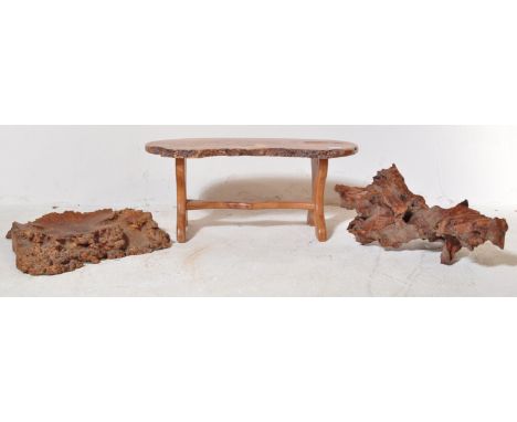 A selection of 20th Century living edge / root wood carved / polished pieces comprising a small side table raised on shaped s