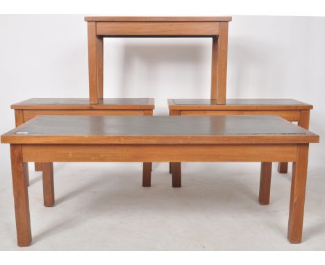 A retro mid Century living room suite comprising of a large coffee table / low table and three matching occasional side table