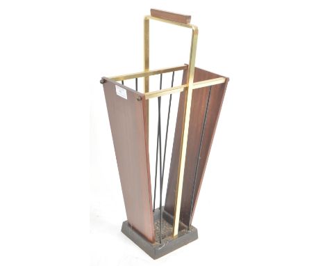 A retro mid 20th Century teak and brass umbrella stick stand of tapering form having a carrying handle top upon a cast iron b