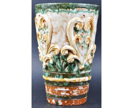 A vintage mid 20th Century Italian Majolica vase of tapering cylindrical form with moulded foliate decoration and drip glazed