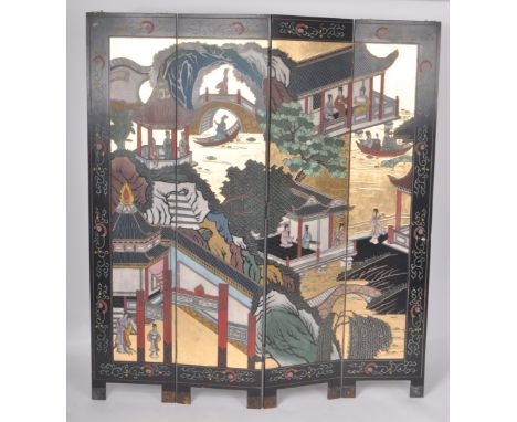 An early 20th Century Chinese four-fold black lacquered room divider / dressing screen. The four hinged panels with each havi