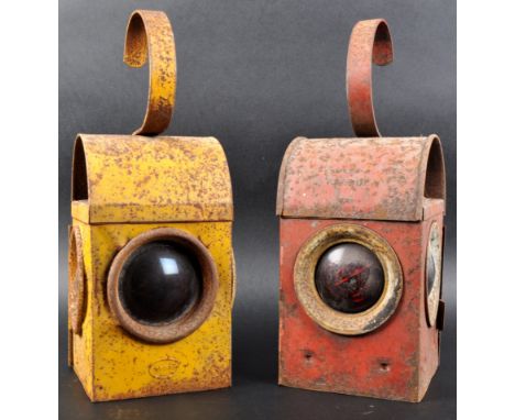 A pair of vintage 20th Century road danger lanterns with one finished in yellow and the other red with both having red glass 