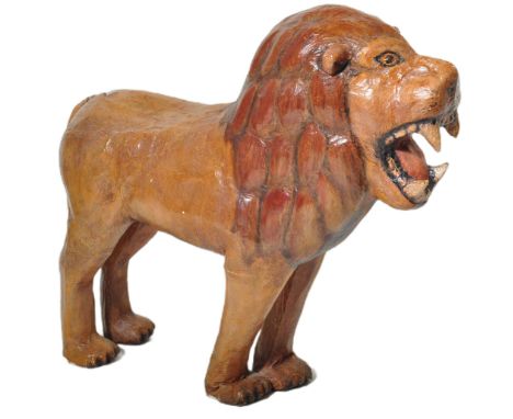 A large vintage early to mid 20th Century papier-mâché lion sculpture with open mouth and firm stance. The Sculpture / fairgr