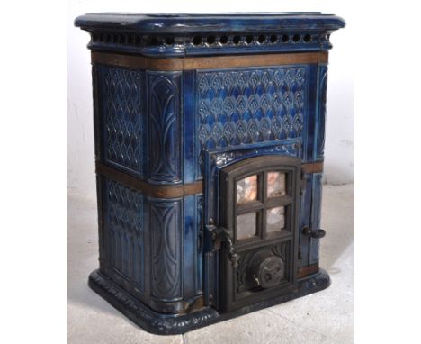 An early 20th Century French cobalt blue enamel wood burner stove. Lattice top with classical decoration throughout. Measures