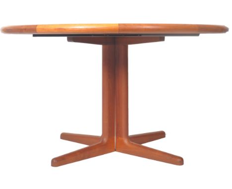 Laurits Larsen -&nbsp;A retro vintage 1960s Danish Scandinavian teak wood extending dining table of circular form having a go