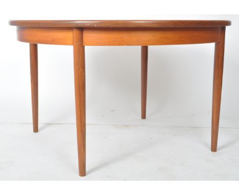 G Plan - British Modern Design - A retro vintage mid 20th century circa 1960s extendable dining table. The table is of circul