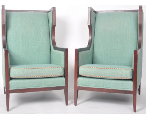 Steed Upholstery - A matching pair of Contemporary wingback fireside / lobby armchairs of cube like form with tall backrests 