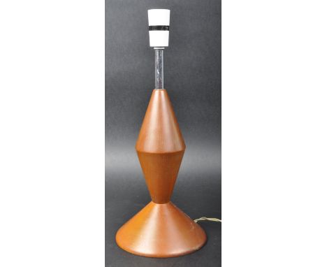A retro mid Century turned teak table / desk lamp light of rocket form raised on a circular foot. Sold as untested. Measures 