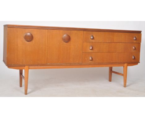 EoN - Elliotts of Newbury - A retro 20th Century designer teak sideboard credenza having a bank of three drawers to the right