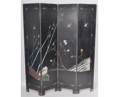 An early 20th Century Chinese four-fold black lacquered room divider / dressing screen. The four hinged panels with each havi