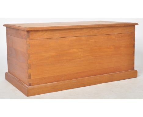 A retro 20th Century solid teak blank box / coffee table of simple rectangular form having a chamfered edge hinged lid openin