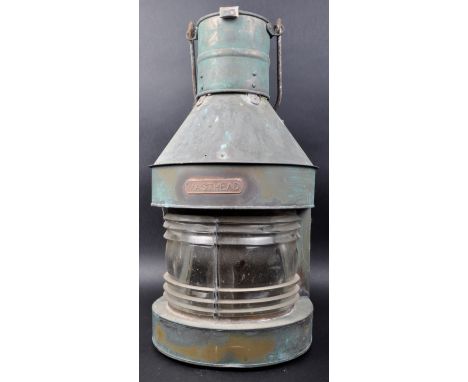 A vintage 20th Century nautical / maritime ships navigation lamp light of brass construction having a ribbed clear glass cent