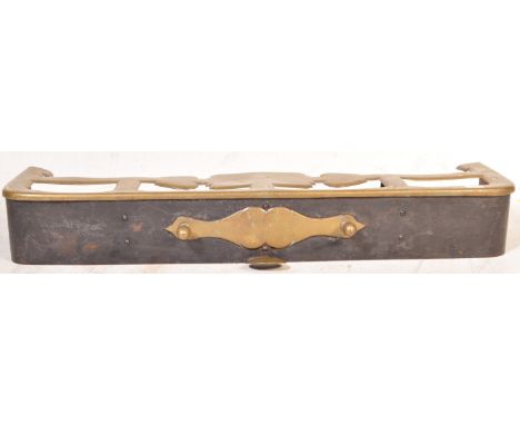 A late 19th / early 20th Century Art Nouveau brass fire fender / surround. Measures approx; 16cm x 114cm.&nbsp;&nbsp;
COLLECT