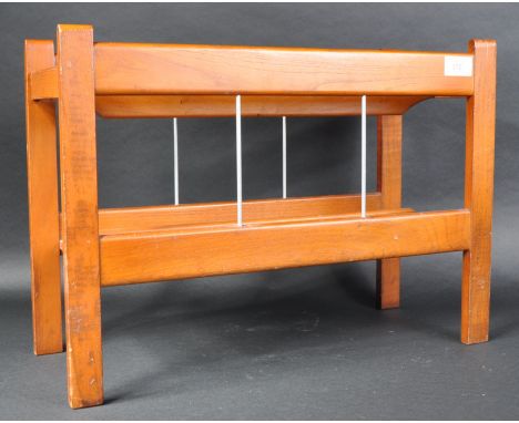 A retro mid Century British Design teak dual section magazine rack&nbsp;/ canterbury having four straight uprights united by 