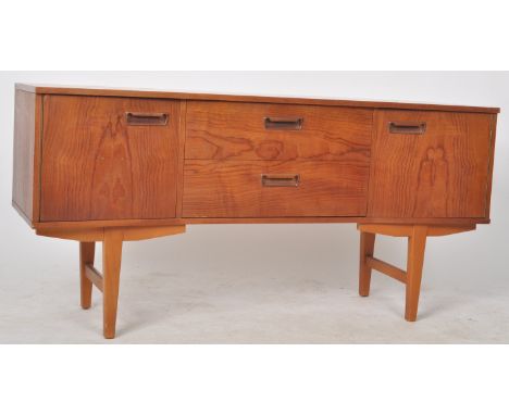 A retro mid 20th Century Danish inspired teak wood sideboard credenza of inverted bow form having a central bank of two drawe