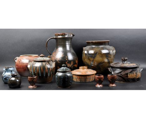 Studio Pottery - A collection of 20th Century studio art pottery wares comprising lidded jars / canisters, large water jug an