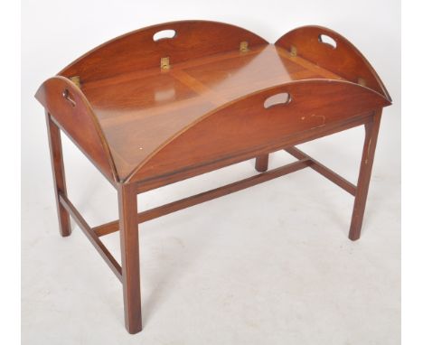 A 20th Century 1980s antique style mahogany butler's tray on stand / coffee table / low table having four hinged folding side