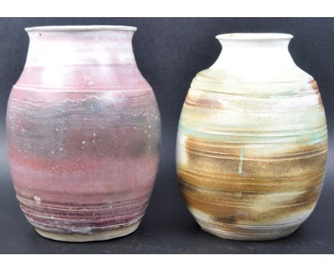 Two&nbsp;retro 1960s / 70s studio art pottery vases each of bulbous form with mottled glazed decoration. Both marked MF to th