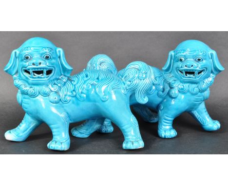 A matching pair of 20th Century Oriental blue glazed ceramic Fu Dogs / Dogs of Foo figures. Each ornament stood with detailed