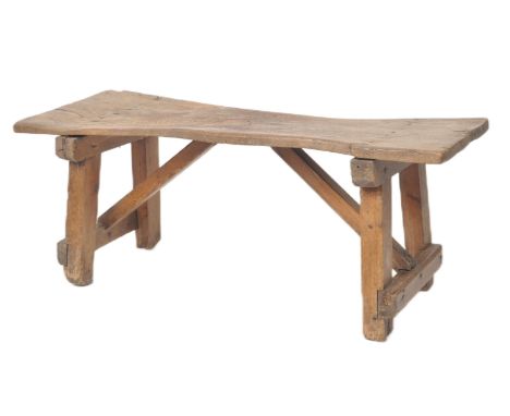 A 19th Century solid elm topped coffee table / low table of rectangular raised on pine A-frame supports united by stretchers.
