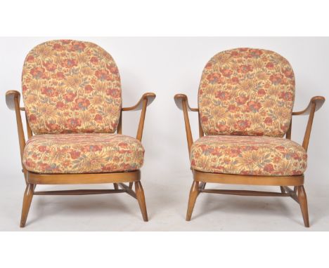 Lucian Ercolani - Ercol - Model 203 - A pair of retro vintage mid 20th century beech and elm easy chairs / armchairs having l