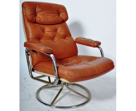 Pieff - An original retro vintage 1970's tan leather and chrome swivel easy lounge reclining armchair / chair having a cushio